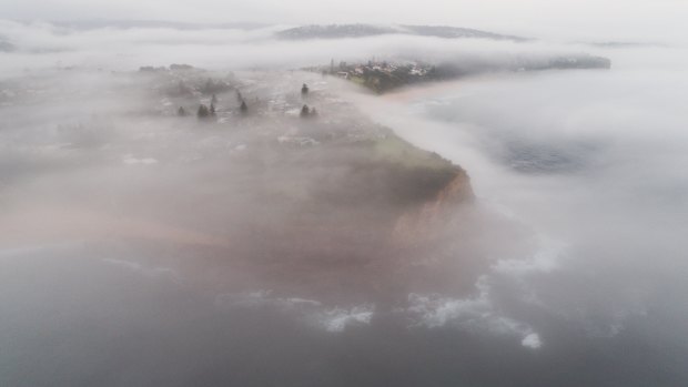 Fog over Sydney’s northern beaches on Tuesday morning, ahead of a warm day that will result in afternoon storms.