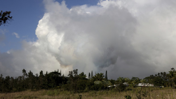 Gases rise from lava fissure 17 after it erupted early on Sunday.