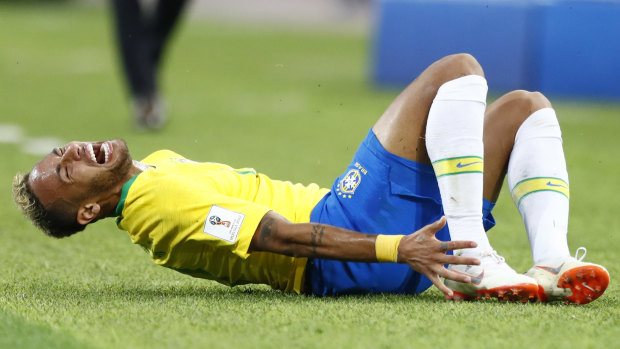 Brazil's Neymar grimaces in pain after a tackle during a match with Serbia. 