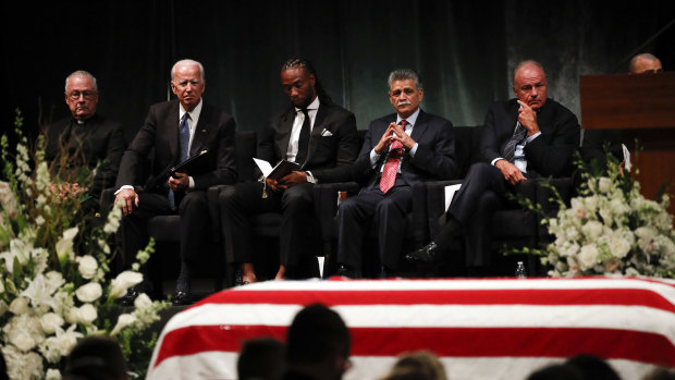 Father Edward Reese, from left, former vice-president Joe Biden, Larry Fitzgerald, Tommy Espinoza, and Grant Woods wait to speak during memorial service at North Phoenix Baptist Church for Senator John McCain on Thursday in Phoenix.