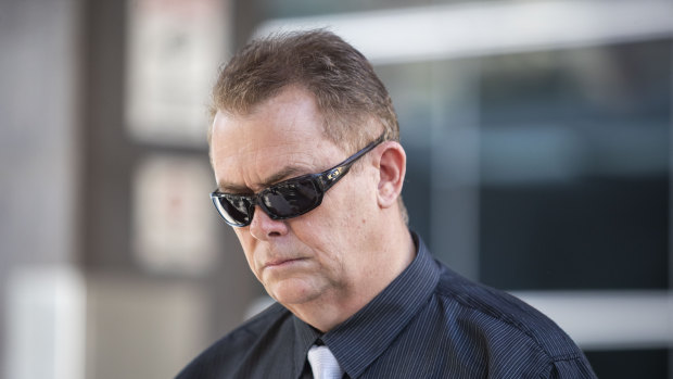 Queensland Police Senior Constable Neil Punchard leaves the Magistrates Court in Brisbane in October.