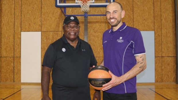 Patty Mills’ father Ben with the University of Queensland’s Dr Keane Wheeler.