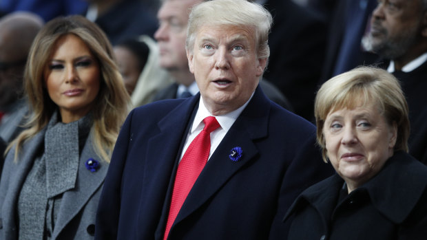 German Chanellor Angela Merkel, right, with Donald Trump and his wife Melania.