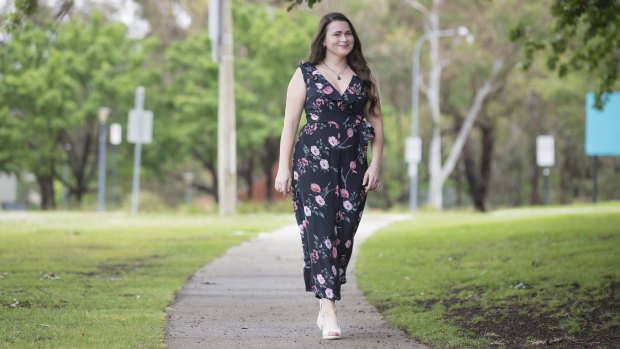 Australian National University graduand Georgia Wilson, pictured at the university on Thursday, had to learn how to walk again after a brain injury in May.