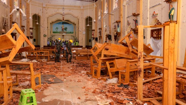 Sri Lankan soldiers inspect the damage inside St. Sebastian's Church where a bomb blast took place in Negombo, Sri Lanka.