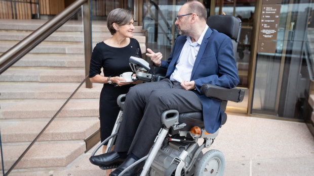 Sydney Opera House CEO Louise Herron with Wheel Easy's Max Burt as he visits the Opera House northern foyer for the first time.