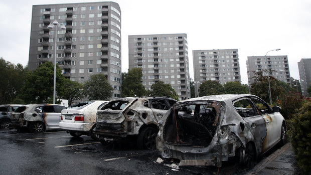 Burned cars parked at Frolunda Square in Gothenburg.