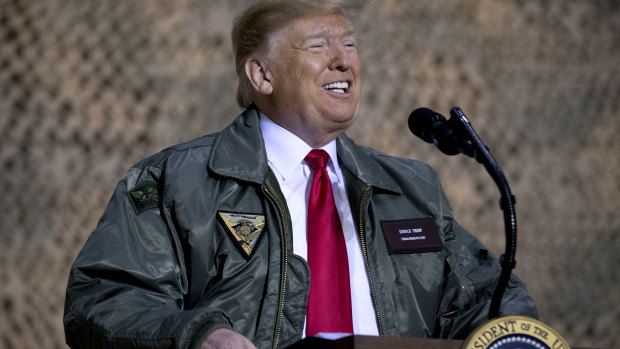 Not so secret: US President Donald Trump speaks to US troops at Al Asad Air Base in Iraq. 
