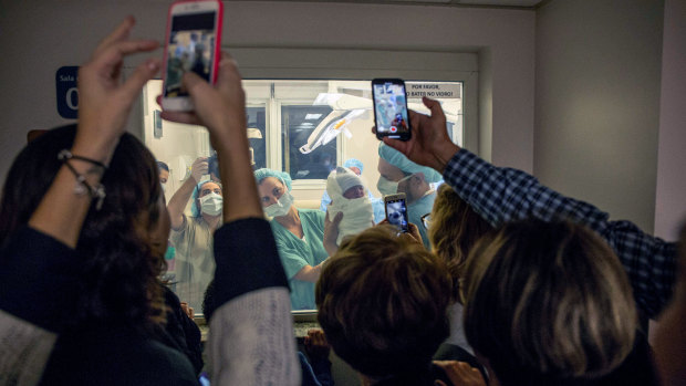 Relatives photograph Mariana Casmalla's newborn baby Lorena at Maternity Hospital Albert Einstein in Sao Paulo last month. 