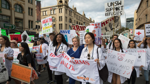 Health professionals were among the thousands that took part in the Palm Sunday rally in Sydney.