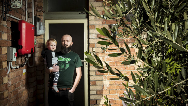 Rob Hoffman and his son, Harry, pose for a photo outside their Coburg home.