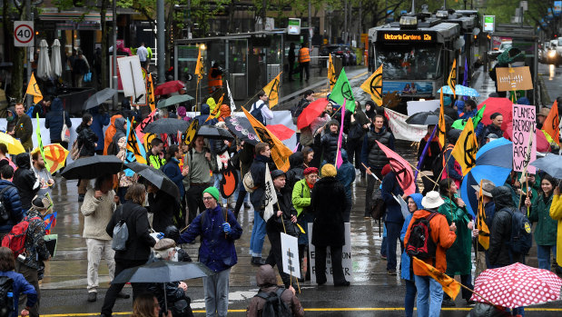 Activists from Extinction Rebellion block an intersection in Melbourne on Tuesday.
