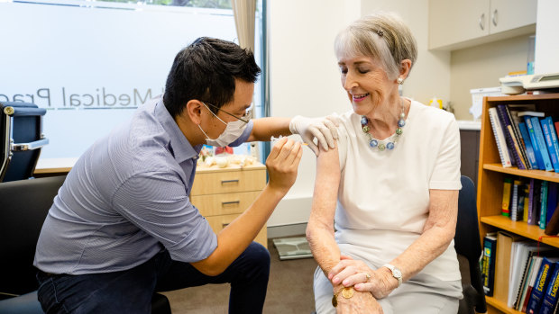 Dr Chris Lee vaccinates a phase1b patient at Lindfield Medical Practice on Monday.