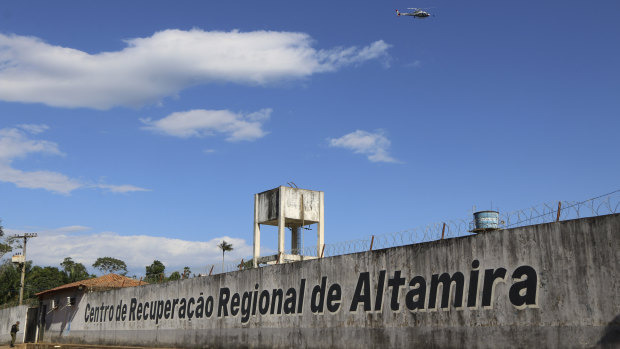 A police helicopter flies over the Regional Recovery Centre, a prison in Altamira, Para state, Brazil.