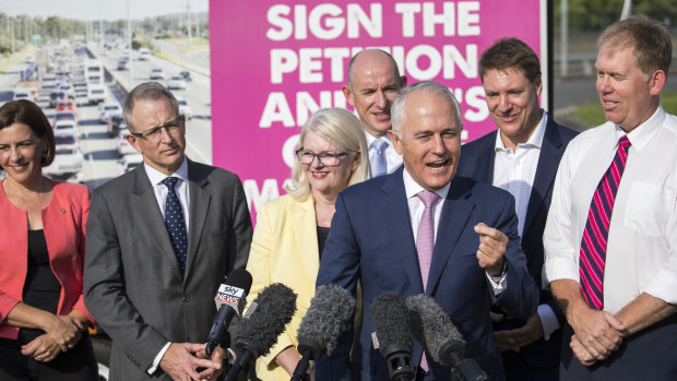 Prime Minister Malcolm Turnbull speaks to the media about a funding plan for the M1 Pacific Motorway in Tanah Merah on April 10.