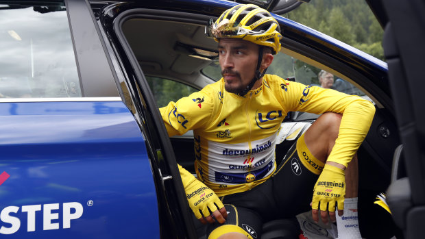 France's Julian Alaphilippe, wearing the overall leader's yellow jersey, was forced to stop riding due to a hailstorm. 