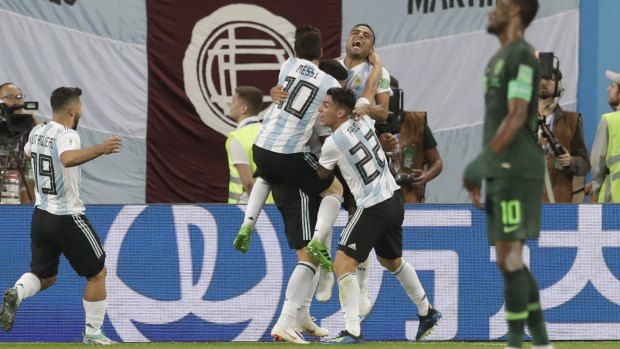 Doing just enough: Argentina players celebrate Marcos Rojo's goal.