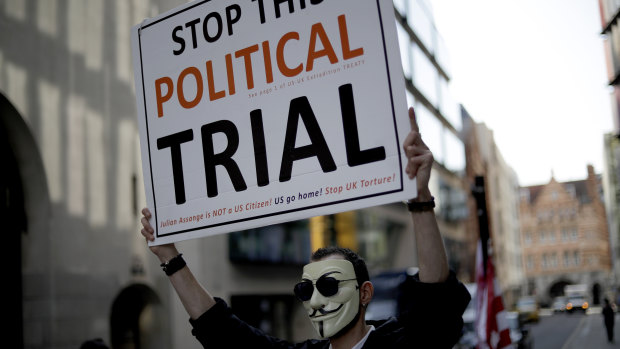 A supporter of WikiLeaks founder Julian Assange takes part in a protest outside the Central Criminal Court, the Old Bailey, in London.