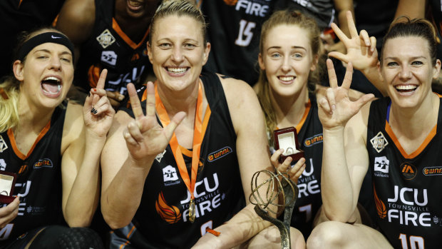 Suzy Batkovic of Townsville Fire celebrates with teammates  after winning the 2017/2018 WNBL championship in January.