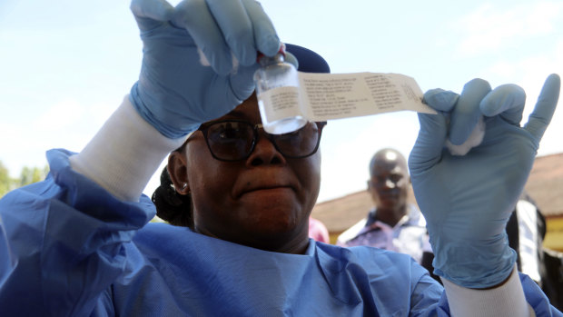 A health worker prepares an Ebola vaccine to administer to health workers in Mbandaka, Congo, on Monday.