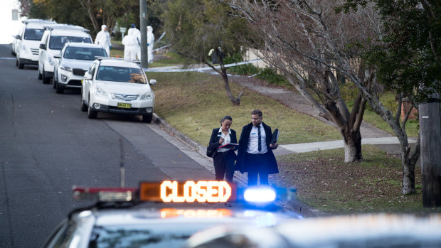 Police arrive on Friday morning to the scene where two teenagers were shot in their bedrooms.