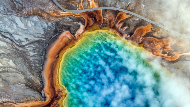 An overhead view of the Grand Prismatic Spring in Yellowstone National Park. Climate change is altering America's first national park so quickly that plants and animals may not be able to adapt. 