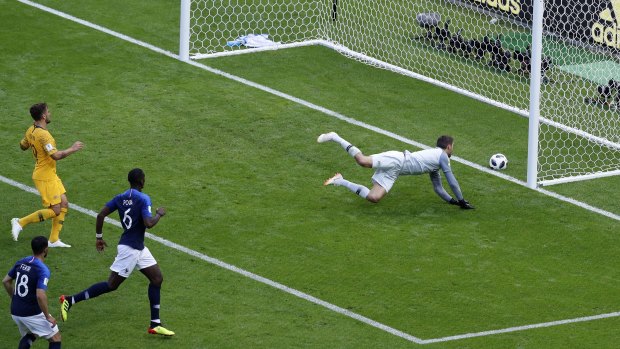 Australia's goalkeeper Mathew Ryan doesn't stop Paul Pogba's shot on goal.