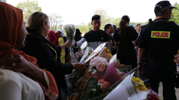 Flowers were handed at the door in show of support to the Muslim community.