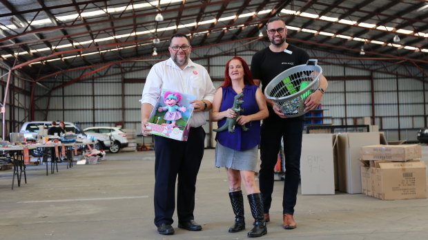 The Salvation Army Queensland's public relations secretary Simon Gregory, mother Fiona Craig and volunteer Robert Draper are calling on Queenslanders to donate to the Christmas appeal after a toy shortage this year.