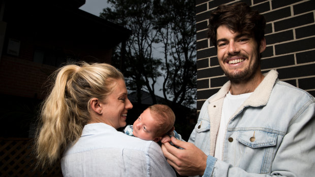 Sydney Swans midfielder George Hewett and partner Alice Summers with their son, Henry.