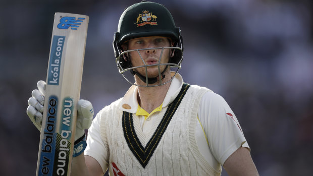 Steve Smith raises his bat as he leaves the ground after being dismissed for 82 runs.