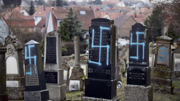 Vandalised graves with tagged swastikas in the Jewish cemetery of Quatzenheim, north-eastern France.