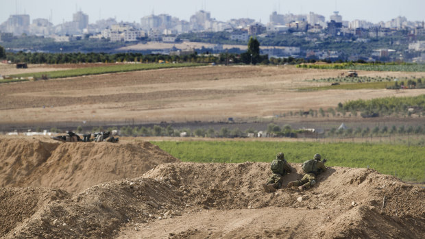 Israeli soldiers observe the Gaza Strip border at the weekend.