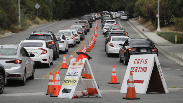Motorists line up at a coronavirus testing site at Dodger Stadium in Los Angeles on Monday.