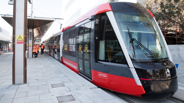 A tram being tested at a stop on High Street at Randwick.