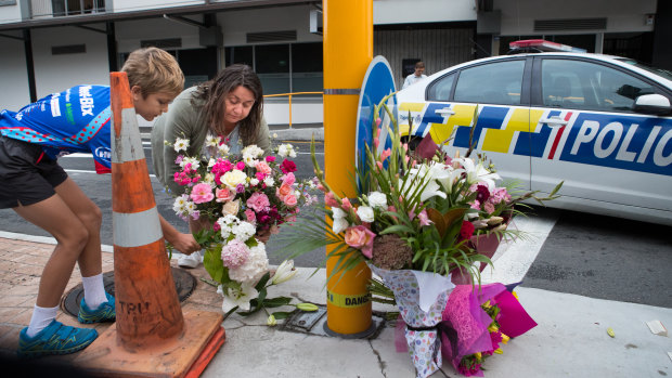 Locals lay flowers at the Masjid Al Noor Mosque in Christchurch.