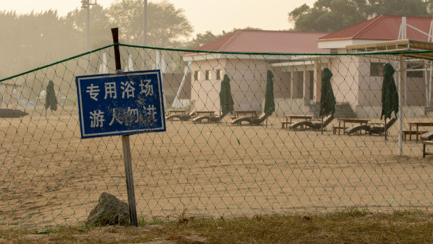 A beach reserved for government officials bans tourists from entering. 