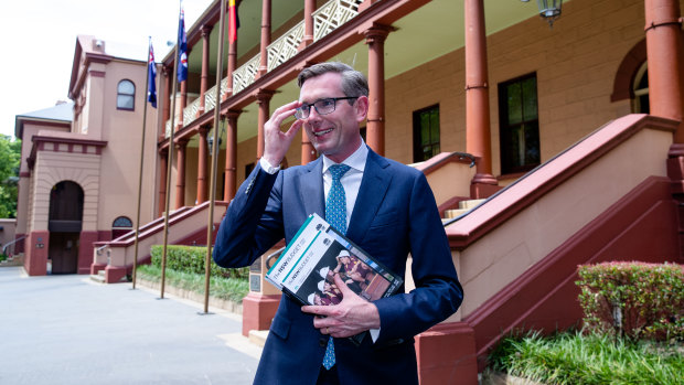 NSW Dominic Perrottet, with the freshly printed budget papers, will deliver the state's biggest deficit in a generation.