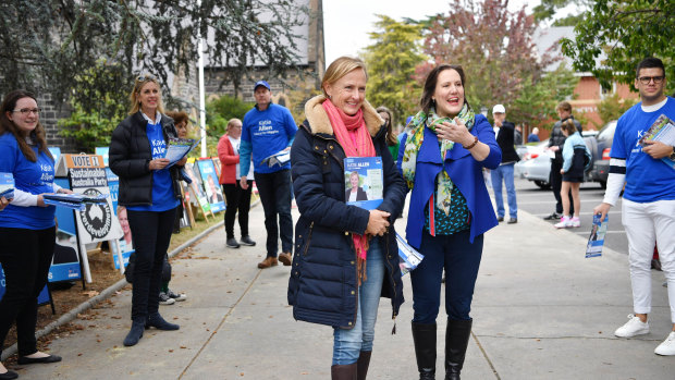 Katie Allen and Kelly O'Dwyer campaign on a pre-poll booth in Higgins on Saturday.