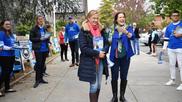 Katie Allen and Kelly O'Dwyer campaign on a pre-poll booth in Higgins on Saturday.