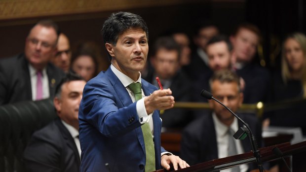 Victor Dominello on his feet during question time on Wednesday.