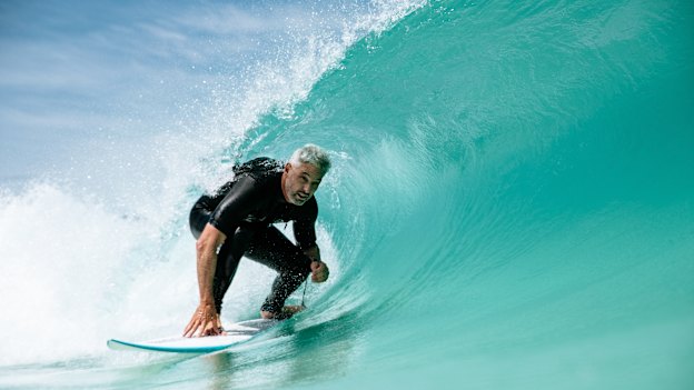 Urbnsurf founder Andrew Ross rides an artificial wave at his facility.