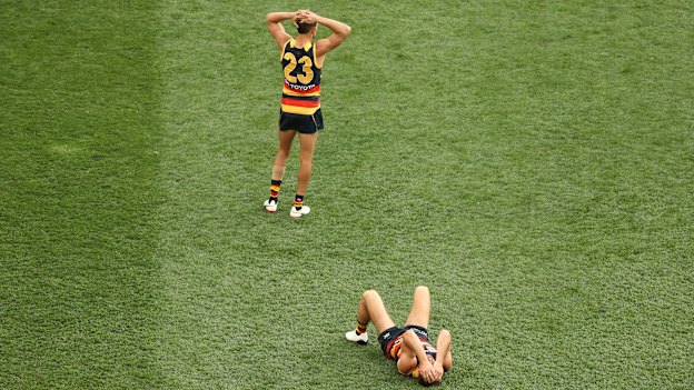 Dejected Adelaide Crows players after their defeat by the Richmond Tigers in the 2017 AFL Grand Final. 