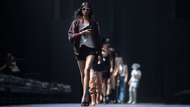 Models practise walking on the runway ahead of the Grand Showcase at VAMFF.