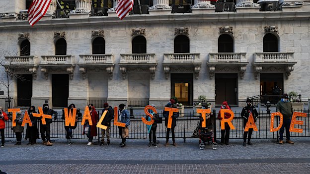 “Tax Wall Street trades”: a group of demonstrators outside the New York Stock Exchange building protest against restrictions on trading GameStop amid stock chaos in New York City on January 28. 