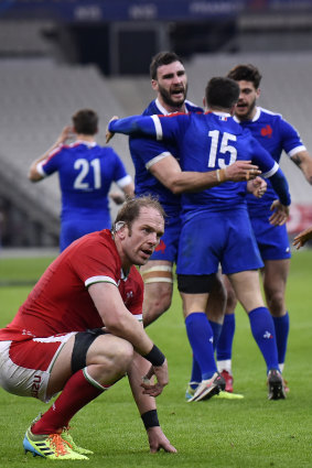 Alun Wyn Jones of Wales reacts as Brice Dulin of France celebrates his winning try with Charles Ollivon  during the Guinness Six Nations match between France and Wales at Stade de France on March 20, 2021 in Paris, France.
