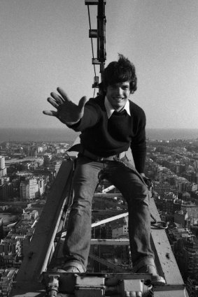 A young Mark Burry sitting atop a crane at the Sagrada Familia in 1980.