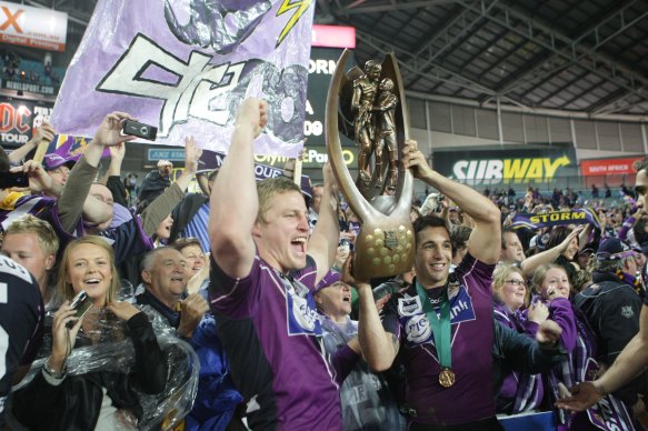 Brett Finch hoists the Provan-Summons trophy with Billy Slater after helping the Storm to victory over Parramatta in the 2009 grand final.