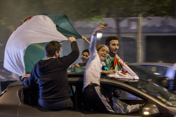 French-Algerian youth in Paris pile into a car to celebrate after Algeria were crowned soccer champions of Africa last month. The driver should not be mistaken for a young Tony Wright.