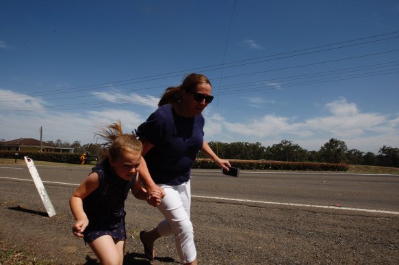 Residents flee along Putty Road in East Kurrajong.